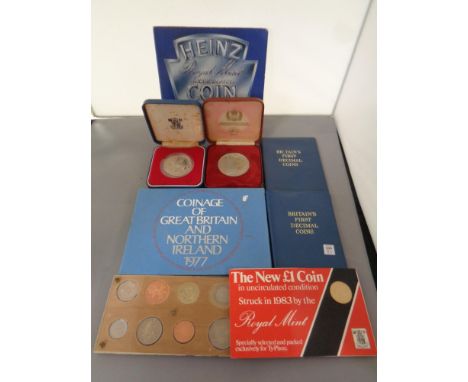 A box containing uncirculated coin sets to include coinage of Great Britain and North Ireland 1977, Heinz coin collection 198