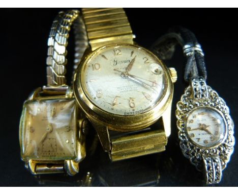 Three vintage dress watches to include a ladies marcasite set wrist watch and two others