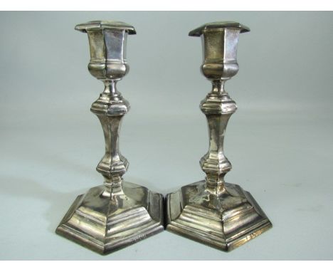 Hallmarked silver weighted candlesticks of Architectural form. Hallmarked London 1905, Thomas Bradbury and Sons. 