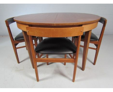 Hans Olsen for Frem Rojle Mid Century teak table and four chairs upholstered with black leatherette - fitted to table. Table 