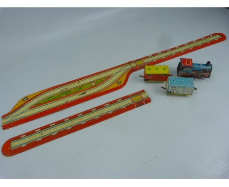 German vintage tinplate clockwork train, carriages and track.