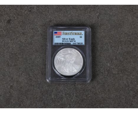 A 2009 Silver Eagle (first strike) $1 coin MS 70, certificate number 14178535.