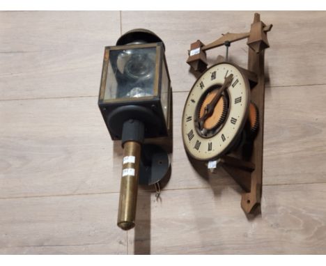 A VINTAGE COACH LAMP WITH ETCHED GLASS TOGETHER WITH A WOODEN CLOCK MOVEMENT
