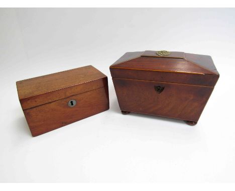 A Georgian mahogany tea caddy with bun feet and another (2)