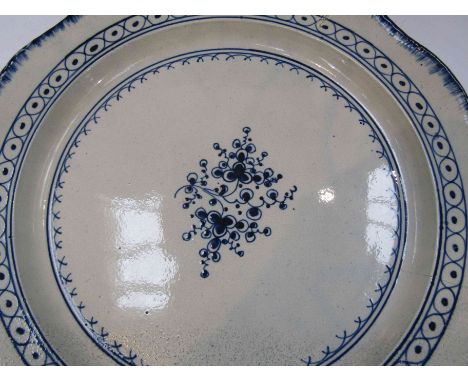 Two 18th Century blue and white chargers in the Worcester style, hairlines to both, 39cm diameter