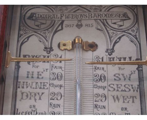An Admiral Fitzroy barometer with paper charts, mercury table and aneroid thermometer