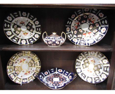 A Royal Crown Derby Imari shaped serving dish, three dessert plates, dinner plate and a twin handle lidded sucrier, pattern 2