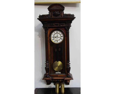 A Vienna wall clock with pendulum and two weights, 102cm tall