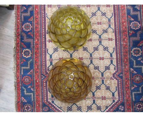 A pair of R. Lalique, France amber glass 'Rinceaux' pattern Plafonnier ceiling light shades, one with substantial crack, 37cm