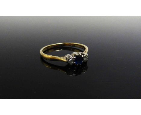 An 18ct gold platinum set diamond and sapphire ring. Size R/S, 2.3g