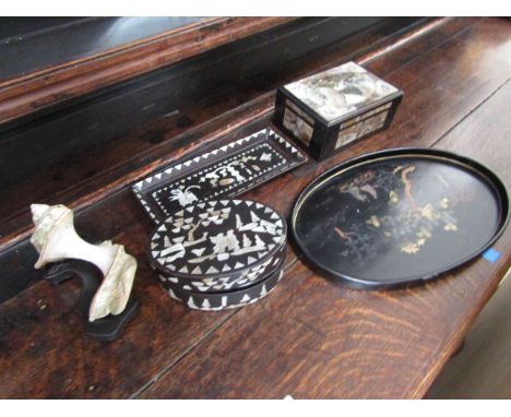 A selection of Oriental lacquered wares including a mother of pearl inset, boxes, pen tray and carved shell (5)