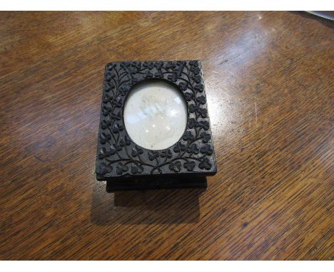 A George III bog oak snuff box 1818, areas of damage present, 10.5cm x 8.5cm