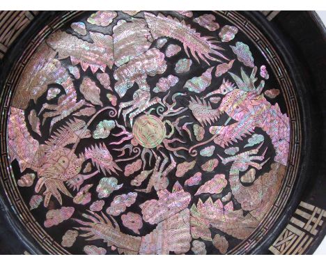 An Oriental mother-of-pearl inlaid bowl with dragon design, 34cm diameter