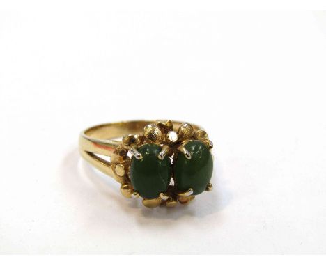 A jade two stone ring with yellow metal shank. Size O, 4.1g