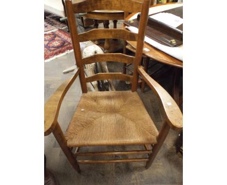 Set of 6 oak ladder back dining chairs with rush seats, 4 standards and 2 carvers 