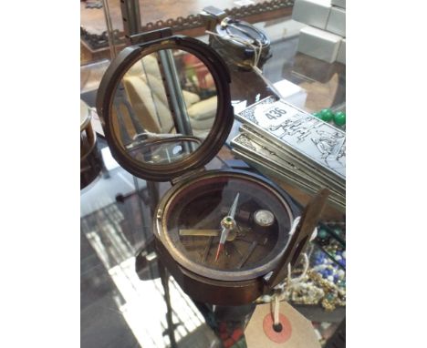 A brass cased round Brunton compass 