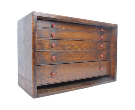 A vintage mid 20th Century oak workmen's tool chest of simple form having an oak case housing a bank of graduating drawers ea