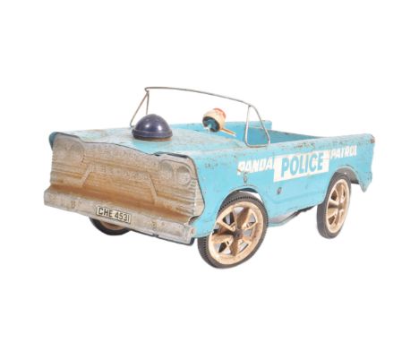 A vintage 20th century pedal car in the form of a Police Patrol car finished in light blue with white writing. Raised on four