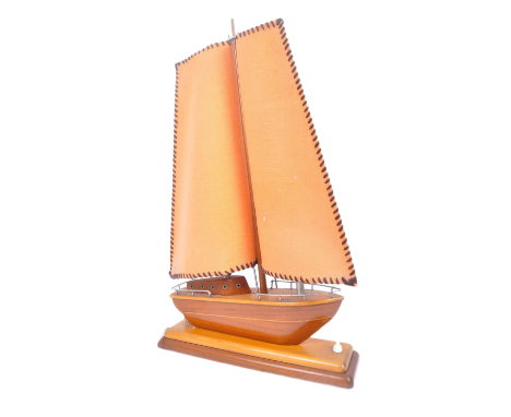 A retro vintage mid 20th Century teak wood table / bedside lamp light in the form of a sailing boat having two shades forming