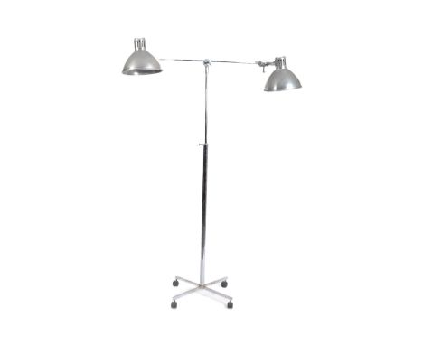 A retro 20th century industrial adjustable lamp light stand having twin arms with polished aluminium shades. All supported by