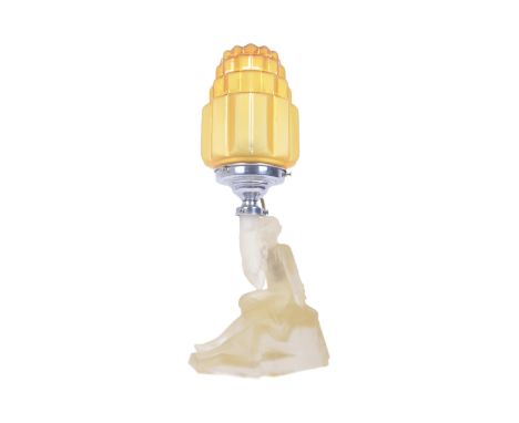 A retro vintage early 20th century Art Deco pressed glass table lamp in the form of a reclined nude maiden. The figural lamp 