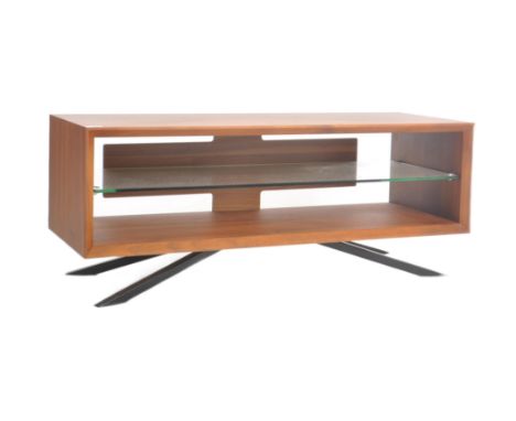 A contemporary designer walnut media stand / hi-fi unit having central glass shelf with all raised on splayed metal supports.