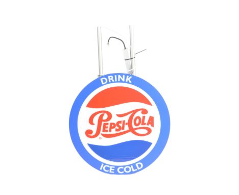 A retro vintage 20th century Pepsi Cola Drink Ice Cold circular light up advertisement shop sign, advertising for soft drink 