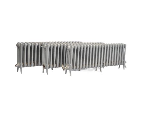 Architectural Salvage - A set of three contemporary Victorian style low cast iron radiators each of 20 bars finished in grey.