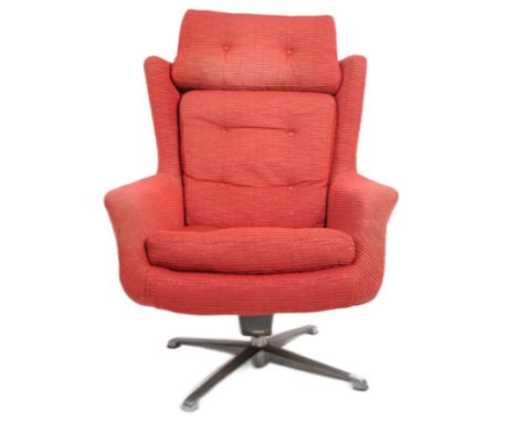 A retro mid 20th century designer swivel lounge armchair / easy chair having a cushioned button back back and seat rest. Shap