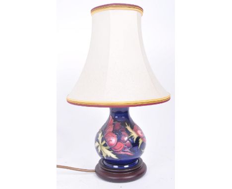 Moorcroft Pottery - A vintage 20th Century hand painted ceramic table lamp light having a slender neck over a bulbous body ra