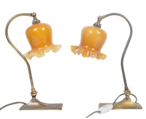 Christopher Wray - A pair of vintage 20th century Art Deco influenced table lamp lights. Each having a amber glass crimpled r