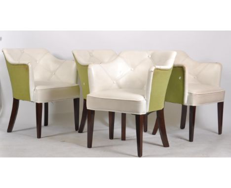 A set of four contemporary stitched faux white leather and green fabric upholstered dining chairs / side office chairs having