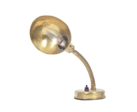 A vintage 20th century Art Deco brass adjustable table lamp light having a cupped shade supported upon a gooseneck arm with a