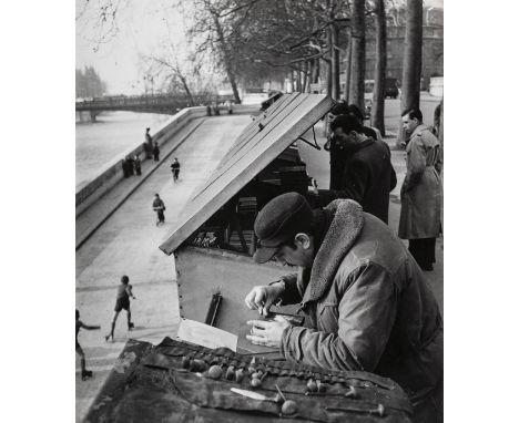 *Doisneau (Robert, 1912-1994). George Sulzbacher, student, finds the time for his great hobby, engraving, circa 1960s,  vinta