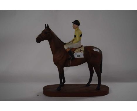 A Beswick horse model of Arkle with Pat Taaffe up, underside of horse with factory mark and title