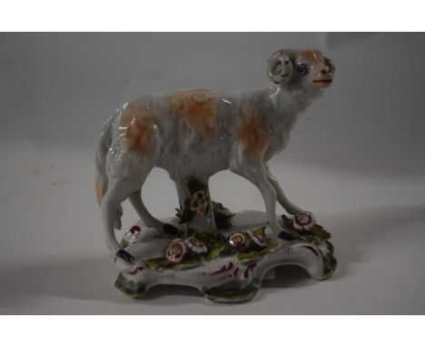 An English porcelain model of a ram on shaped base applied with flowers, possibly Bow or Derby, 10cm long