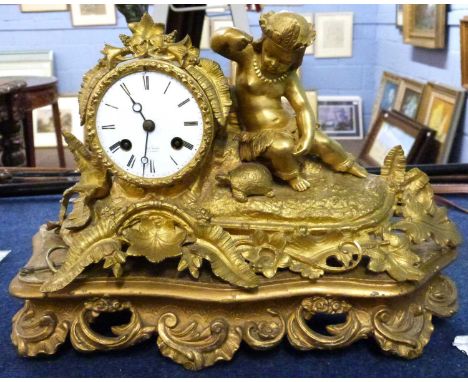 A late 19th Century gilt brass clock, the white enamel dial marked RRY Marc Paris, the clock complete with pendulum and key, 