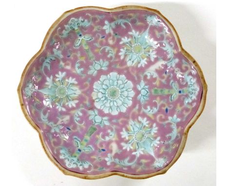 A Chinese porcelain bowl of petal shape, the pink ground decorated with flowers, 18cm diameter, Chinese seal mark to base wit