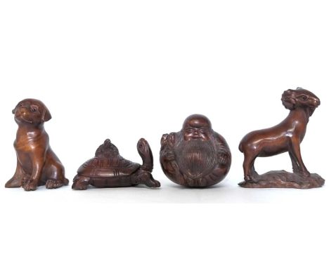 Four Netsuke carved animal figures, modelled as a Ram, a tortoise, a dog and a Buddha.