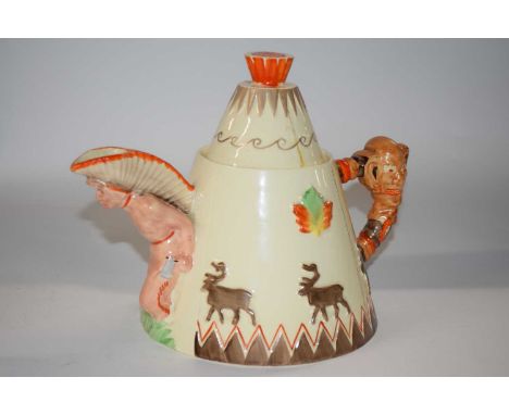 A rare Clarice Cliff novelty teepee teapot, the base marked with factory stamp and Greetings from Canada (repair to cover)