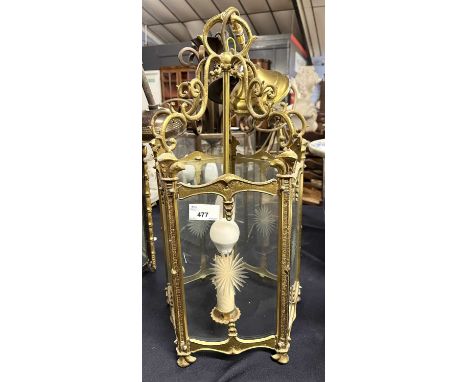 A hexagonal brass mounted two light lantern ceiling light fitting with star cut glass panels, 49cm high