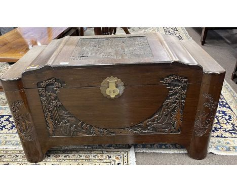 An Oriental camphor wood storage trunk with carved decoration, 100cm wide (Item 124 on vendor list)