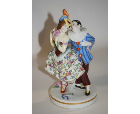 A continental porcelain model of a Harlequin and Columbine on circular base, 19cm high