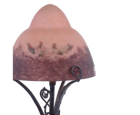 An early 20th century Art Nouveau patinated copper table lamp, with grapevine design base and Studio coloured glass shade, et