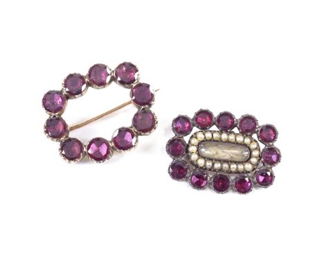 2 Georgian unmarked gold flat-cut garnet memorial brooches, one example with central hair panel and split pearl surround, lar