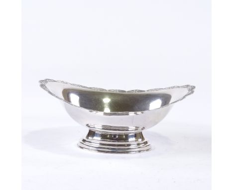 An Elizabeth II oval silver pedestal bon bon dish, scalloped rim with engine turned floral decoration, by Mappin & Webb, hall