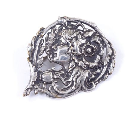 An Art Nouveau silver plated brooch, depicting female profile and flowers, signed L Deverin, length 40.7mm, 7.4gVery good ori