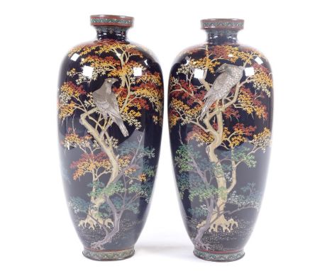 A pair of Japanese Meiji period cloisonne vases, dark blue enamel bodies with eagles in Acer trees, height 26cm. Vase 1 - int