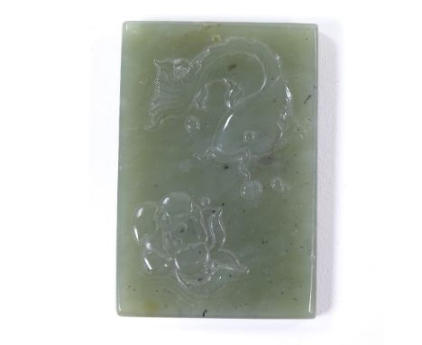 A Chinese relief carved jade rectangular pendant plaque, length 7cm 