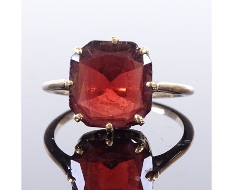 An unmarked gold flat-cut garnet dress ring, setting height 12.8mm, size P/Q, 3gVery good overall condition, garnet has very 